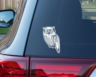 Artistic silhouette of an owl with great big eyes.