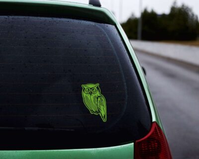 Artistic silhouette of an owl with great big eyes.