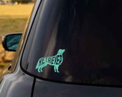 Sweet Golden Retriever dog decal with inset text 'RETRIEVER'.