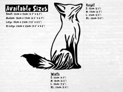 Sweet little fox sitting watching her surroundings, snout in the air and ears alert, with her bushy tail extended outwards.