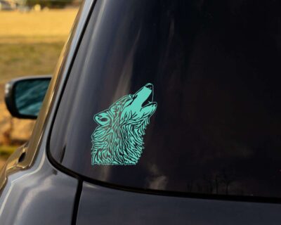 Head of a wolf howling at the moon