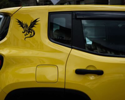 Silhouette of a fierce looking dragon with wings spread