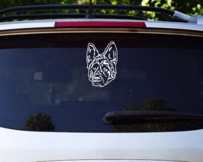 Super cute silhouette of a german shepherd alsatian dog looking straight ahead with a serious look on his face. This guys means business!