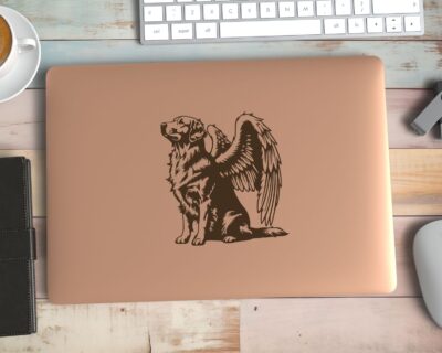 Vinyl decal of a majestic golden retriever dog with large angel wings. The dog is depicted sitting upright with a calm and serene expression, its head slightly tilted upward as if looking toward the heavens. Detailed fur markings create a textured, realistic look throughout the body, while the strong wings extend gracefully from its back, showcasing layered feathers with intricate line work.