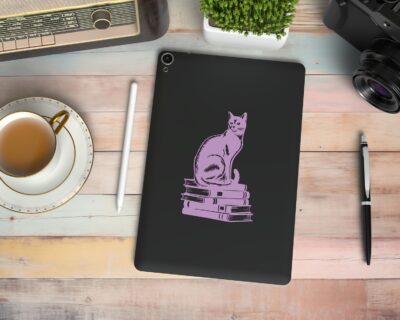 Vinyl decal of a cat sitting gracefully on a stack of books, rendered in a bold silhouette style.