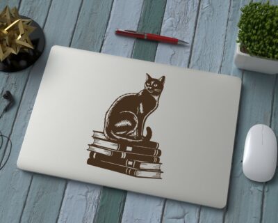 Vinyl decal of a cat sitting gracefully on a stack of books, rendered in a bold silhouette style.