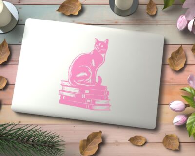 Vinyl decal of a cat sitting gracefully on a stack of books, rendered in a bold silhouette style.
